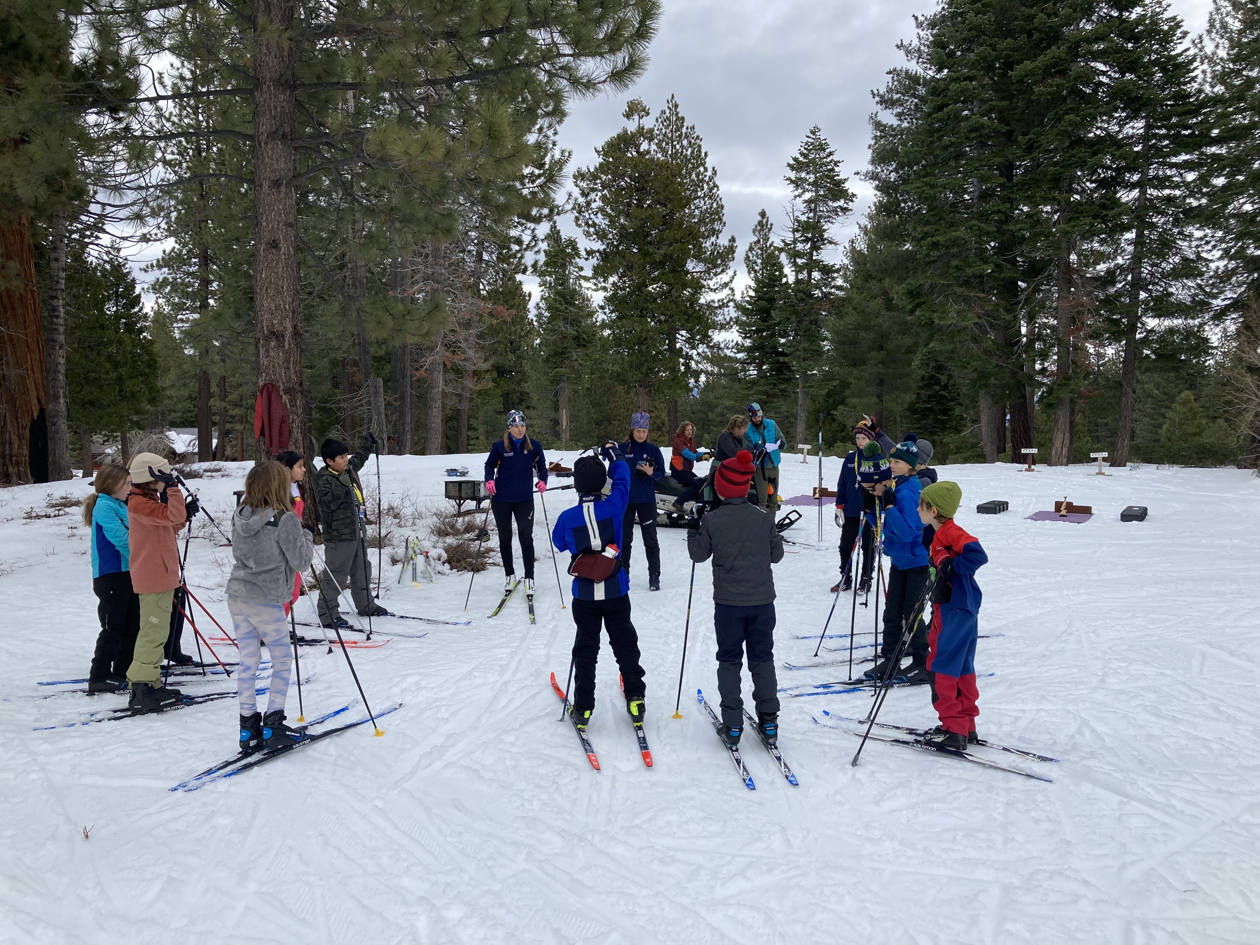 Strider Glider biathlon athletes circle up for instruction.